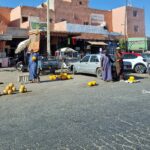 Men in traditional Dejellaba at highway markets