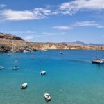 Boats anchored in the tranquil waters of Lindos Bay