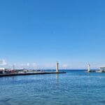 Rhodes Harbour with Ekklisia Evaggelismos on the left and the pillars of the Colossus of Rhodes on the right