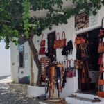 Souvenir shops and wines dot the lanes of Lindos